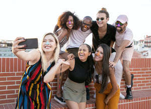 Group of friends taking a selfie wearing Noz reef safe, cruelty free face sunscreen on their the nose. 